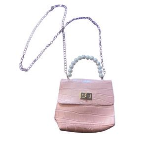 Pink and gold bag with pearl handle